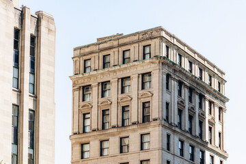 Montreal, Canada - August 11, 2025: Historic State Street Building next to Aldred Building on Place d'Armes in Old Montreal with classic architectural details