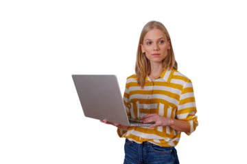 Young woman standing, working remotely on laptop, typing with serious expression, transparent background