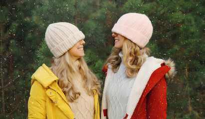 Happy smiling women friends having fun, celebration, joyful girlfriends together on Christmas tree