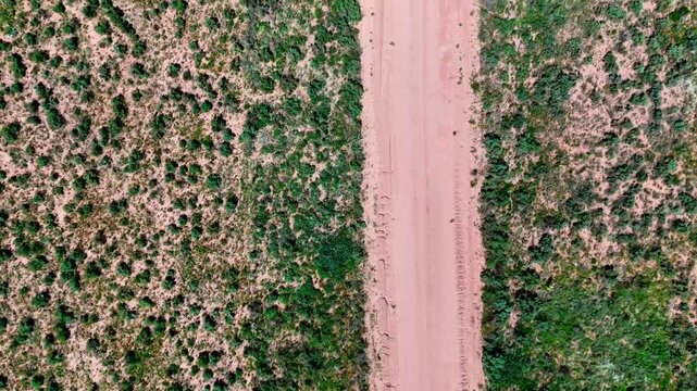 Aerial top down of rural desert road in summer historic US route 66 San Jon New Mexico NM