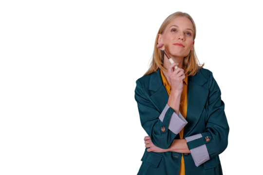 Blonde woman contemplating beauty choices, holding a makeup brush, thinking, with transparent background