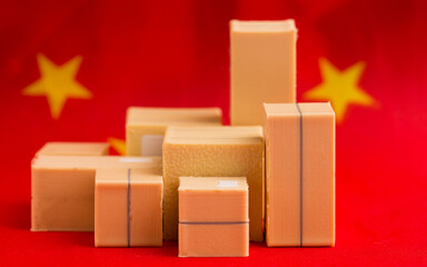 boxes with parcels against the background of the Chinese flag