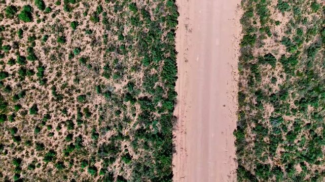 Aerial top down of rural desert road in summer historic US route 66 San Jon New Mexico NM