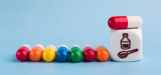 medical cubes and pills on a blue background