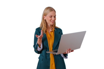 Woman standing and holding a laptop, engaging in a virtual business meeting or online discussion with a cheerful expression