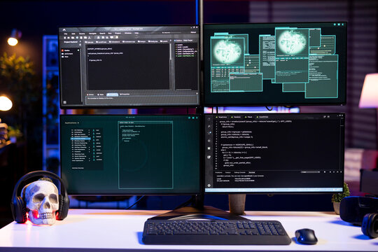 Hacking code scripts running on computer system monitors attacking firewalls. Programming language malware software shown on PC screen used by cyber criminals to breach security