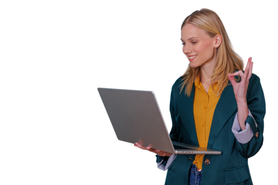 Young businesswoman using laptop, smiling and showing ok gesture, symbolizing approval and success, transparent background - Powered by Adobe