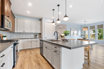 A spacious kitchen with a large island in the center of the room