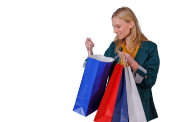 Happy woman holding colorful shopping bags looking inside a purchase, enjoying shopping experience, transparent background