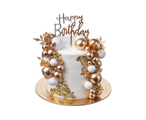 A beautifully crafted birthday cake featuring gold and white decorations, including shiny orbs and floral accents, perfect for a festive event