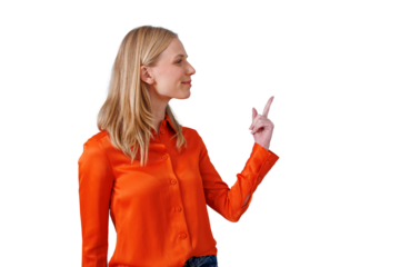 Woman in orange shirt smiling and pointing up, indicating direction, attention, or space for text with transparent background