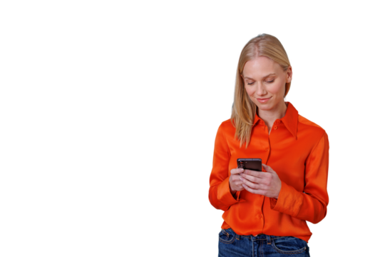 Woman standing and smiling while messaging using a smartphone, communicating remotely. Transparent background - Powered by Adobe