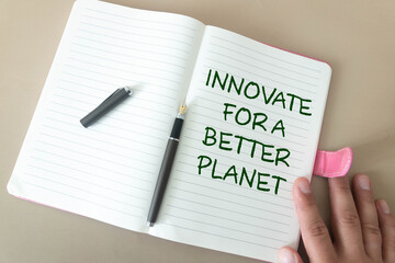 Notepad and the inscription Innovate for a better planet