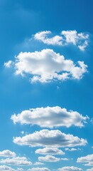 Fototapeta premium Expansive vibrant azure sky with scattered white fluffy cumulus clouds. A peaceful natural backdrop ideal for various design needs ,freedom ,weather ,day