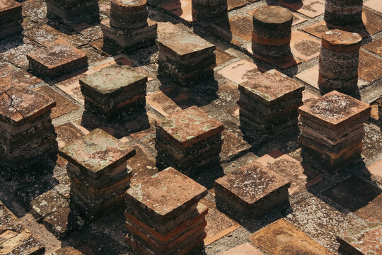 A view of the Ancient Roman Baths in Stobi, North Macedonia, showcasing well-preserved ruins, intricate mosaic floors, and classical Roman architecture