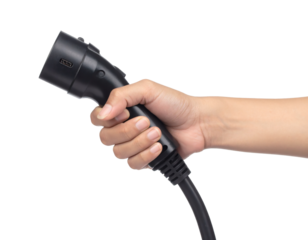 Modern hand holding black electric car charger plug for eco friendly vehicle power, renewable energy future focus