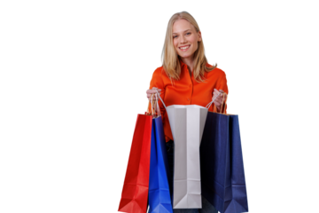 Blonde woman smiling, holding multiple colorful shopping bags, feeling happy after a successful retail therapy experience