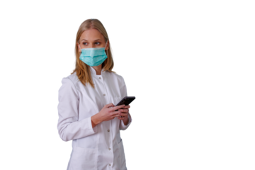 Healthcare professional wearing medical mask and holding phone, communicating during health crisis, transparent background