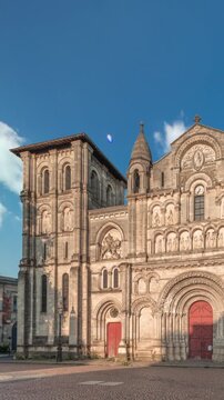 Eglise Abbatiale Sainte-Croix timelapse hyperlapse in Bordeaux, France, Romanesque Catholic church with a medieval facade. Landmark showcases rich architectural and cultural heritage under a blue sky