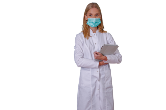 Woman medical professional wearing face mask and white lab coat, holding digital tablet, representing healthcare and scientific research