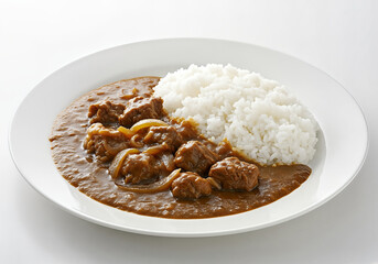 Delicious plate of japanese curry with rice, featuring tender meat and savory sauce, comfort food.