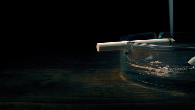 Passing Cigarette On Ash Tray
