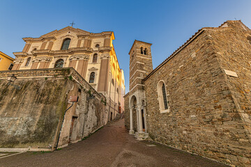 Church Santa Maria Maggiore and Basilica di San Silvestro in old town of Trieste, Italy