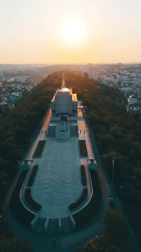 Witness the stunning sunrise over the National Monument at Vitkov. This historic site honors Jan Zizka and offers breathtaking views of Prague from its hilltop location.