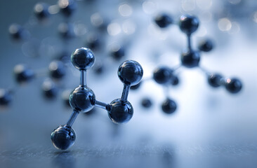 Molecular structure representing scientific research sits on a reflective surface, symbolizing innovation and discovery in a laboratory setting.