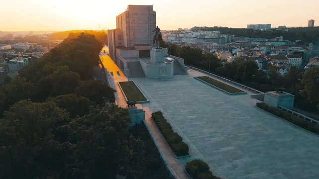 Witness the breathtaking sunrise at the National Monument at Vitkov. This site features the impressive equestrian statue of Jan Zizka on a hilltop in Prague, showcasing stunning views.