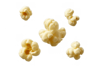 Popcorn kernels floating in the air, a light and tasty snack perfect for cinema, parties, and relaxing moments