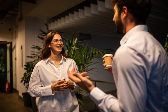 Business colleagues networking during coffee break in office