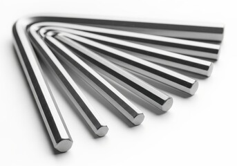Set of polished metal hexagonal keys arranged in a fan shape on a bright surface.