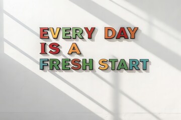 Colorful Text Displaying Every Day is a Fresh Start on a White Wall