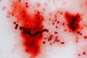 Blood dripping on to snow.forensic blood patterns.Droplets of blood scattered across an icy surface.Crime Scene.Red blood wallpaper.Red Stain on Snowy Ground.bloody trace on snow texture 