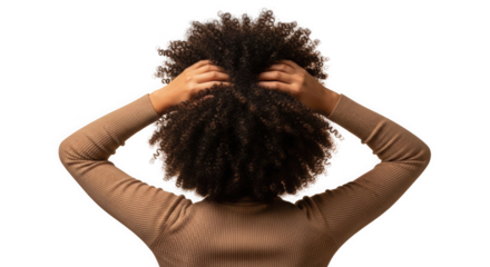 Back view of a person with arms raised tangled in voluminous dark curly hair. Person wearing a textured light brown long-sleeved garment. Close-up of upper body with dramatic hair and pose.