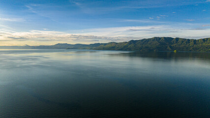 Aerial view of lake Toba in Sumatra among the mountains. Sumatra, Indonesia.