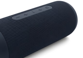 Obraz premium Cylindrical portable audio device features tactile control buttons on its textured exterior