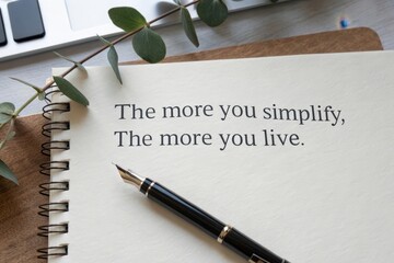 A pen writing the inspirational words the more you simplify