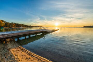 Fototapeta premium Pier at Lubikowo lake at sunset. Poalnd