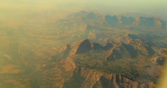 Maharashtra, India. Aerial top elevated View From Airplane Window On View of mountain range. Video From Plane Window. . Western Ghats, Sahyadris, is a mountain range that stretches 1,600 km along the