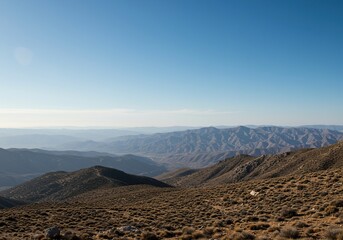 An expansive and stunning panoramic view of a serene natural environment, featuring distant mountains and a clear, open sky above ,calm ,travel ,sweeping view