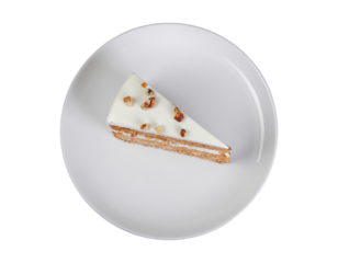 Top view of delicious layered cake with nuts on white plate isolated on alpha