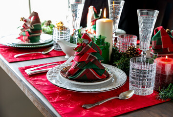 A beautiful Table setting for Christmas against a bright sunny window.