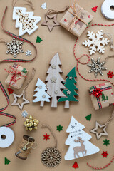 Various holiday decorations against a brown paper background.
