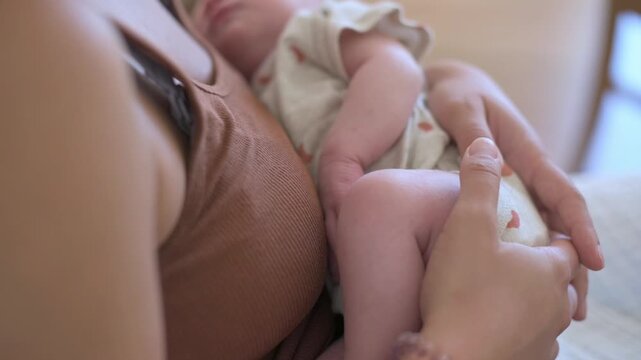 mother gently cradles, mother lovingly shields newborn securely, mother carefully holds infant with loving protection, mother gently and securely cradles her young child with utmost love