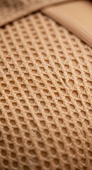 Close-up of a textile with a distinct, rhythmic pattern in neutral, earthy beige tones.