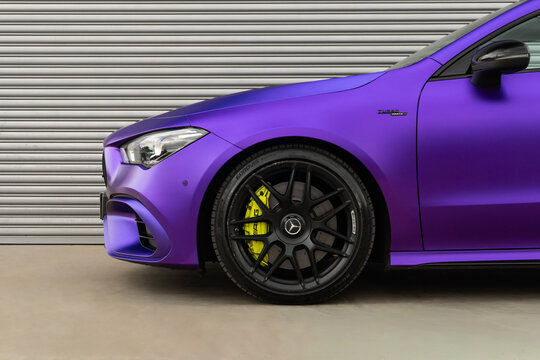 Matte purple Mercedes-AMG CLA 45s front wheel closeup, Performance coupe yellow caliper detail