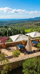 Fototapeta premium Panoramic vista of a rustic terrace with tables overlooking sprawling lush green rolling hills