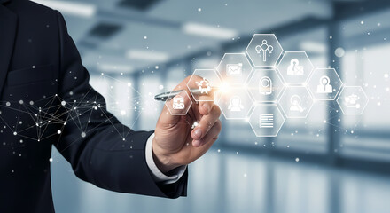 A businessman interacts with a holographic interface, showcasing modern technology and innovative digital concepts within a professional environment.